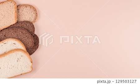 Diet breads assortment with seed loaf on pastel background, copy space 129503127