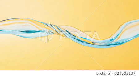 Close-up of blue water on yellow background with air bubbles 129503137
