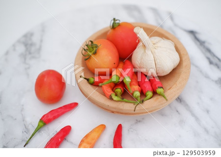 Cooking Ingredients with Red Chili, Garlic, and Tomato Cooking Ingredients with Red Chili, Garlic, and Tomato 129503959