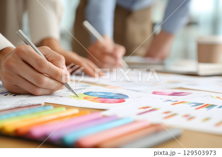 creative team analyzing data charts in office pastel watercolor theme 129503973