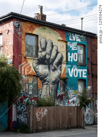 Urban mural with democracy graffiti and hope messages 129504274