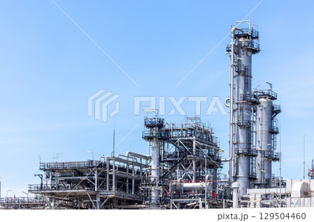 Oil and Gas refinery petrochemical plant industrial on blue sky background, Oil and Gas refinery petrochemical plant pipeline steel, Oil and Gas refinery factory maintenance, Global energy refinery. Oil and Gas refinery petrochemical plant industrial on blue sky background, Oil and Gas refinery petrochemical plant pipeline steel, Oil and Gas refinery factory maintenance, Global energy refinery. 129504460