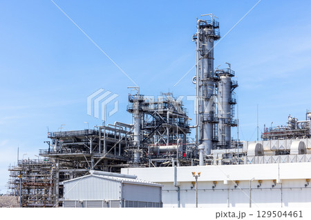 Oil and Gas refinery petrochemical plant industrial on blue sky background, Oil and Gas refinery petrochemical plant pipeline steel, Oil and Gas refinery factory maintenance, Global energy refinery. 129504461