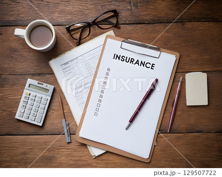 top view office setup with insurance checklist and paperwork 129507722