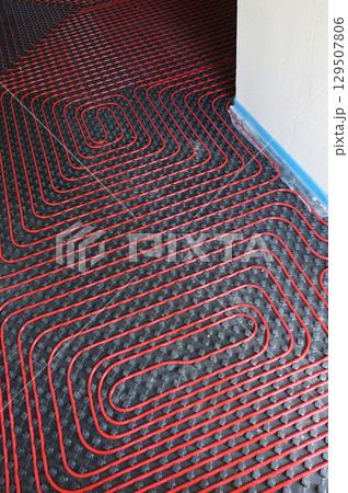 Tubes of radiant underfloor heating installation 129507806