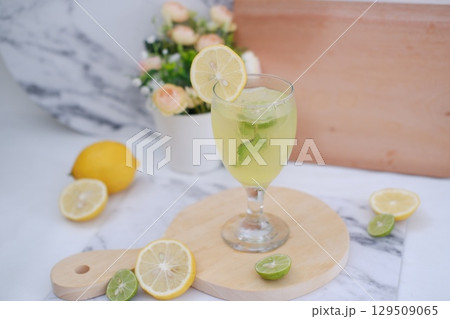 Homemade Fresh Lemon Juice on Wooden Board 129509065