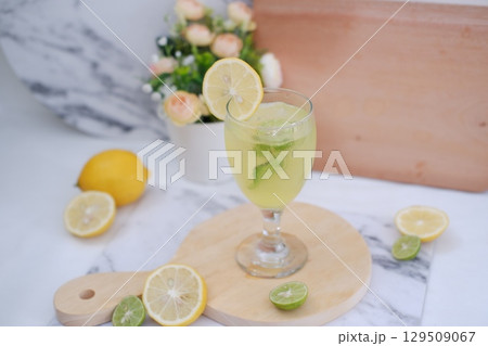Homemade Fresh Lemon Juice on Wooden Board 129509067