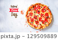 Tasty pizza slices on light background 129509889