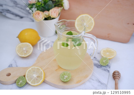 Fresh Lemonade in Glass Pitcher with Mint 129510995