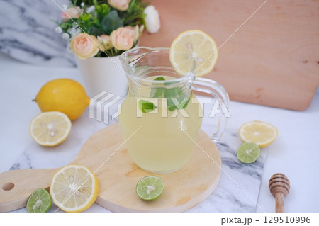 Fresh Lemonade in Glass Pitcher with Mint 129510996