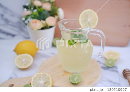 Fresh Lemonade in Glass Pitcher with Mint 129510997