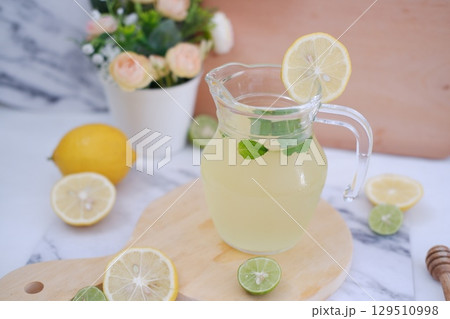 Fresh Lemonade in Glass Pitcher with Mint 129510998