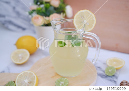 Fresh Lemonade in Glass Pitcher with Mint 129510999