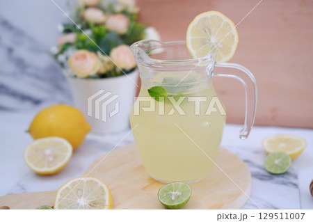 Fresh Lemonade in Glass Pitcher with Mint 129511007
