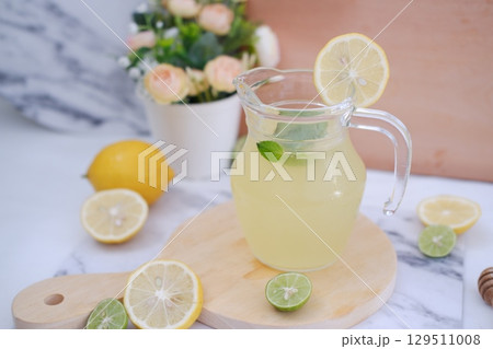 Fresh Lemonade in Glass Pitcher with Mint 129511008
