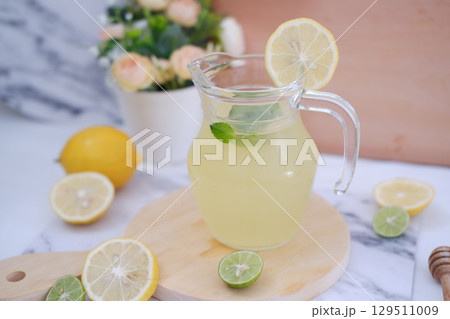 Fresh Lemonade in Glass Pitcher with Mint 129511009
