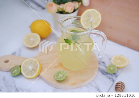 Fresh Lemonade in Glass Pitcher with Mint Fresh Lemonade in Glass Pitcher with Mint 129511016