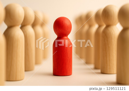 A red figurine in front of two lines of natural figurines symbolizing command and organized following A red figurine in front of two lines of natural figurines symbolizing command and organized following 129511121