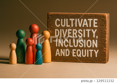 Cultivate Diversity, Inclusion and Equity text on wooden blocks with multicolored wooden figurines next to it 129511132