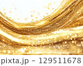 Golden shimmering texture creates a mesmerizing visual effect resembling flowing liquid light, capturing the essence of luxury and warmth in an abstract form 129511678