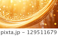 Golden shimmering texture creating an enchanting backdrop with sparkling light and soft gradients, ideal for festive celebrations and joyful occasions during sunset hours 129511679