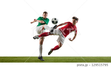 Soccer players kicking ball in midair during match 129515795