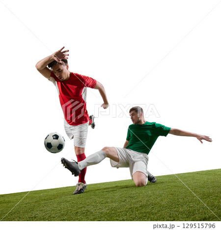 Football players in slide tackle action moment 129515796