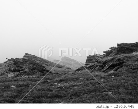 Overcast day in Coomloughra, Ireland, part of the famous Horseshoe, with low clouds and misty weather conditions affecting visibility. 129516449