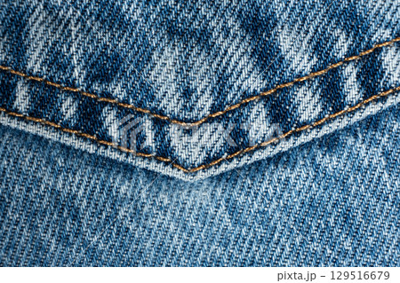 Macro fabric texture of cotton blue jeans. Pocket and thread stitching Macro fabric texture of cotton blue jeans. Pocket and thread stitching 129516679