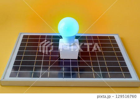 Composition with solar panel, led lamp, on texture background. Composition with solar panel, led lamp, on texture background. 129516760