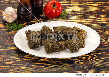 Stuffed dolma - meat in grape leaves 129517010