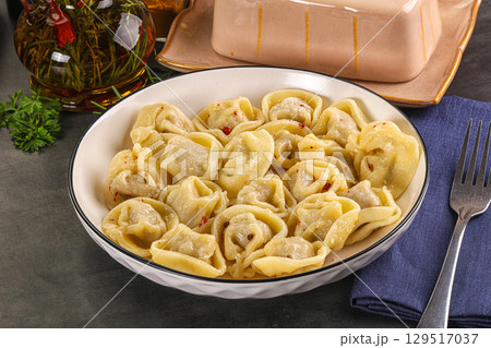 Russian homemade dumplings with meat 129517037