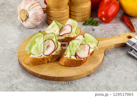 Bruschetta with soft cheese and cucumber Bruschetta with soft cheese and cucumber 129517065