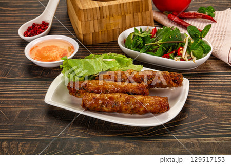 Fried Vietnamese spring roll with special sauce Fried Vietnamese spring roll with special sauce 129517153