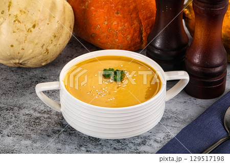 Vegan pumpkin cream soup served sesam 129517198