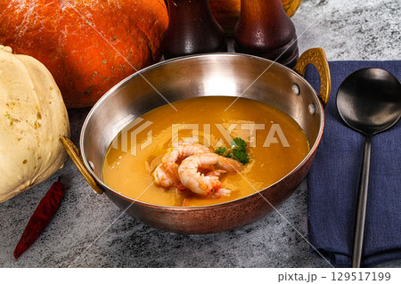 Pumpkin cream soup with prawns 129517199