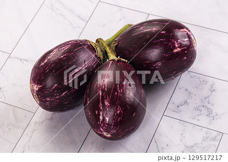 Small round asian eggplant for cooking Small round asian eggplant for cooking 129517217