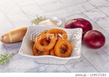 Golden fried onion rings snack Golden fried onion rings snack 129517283