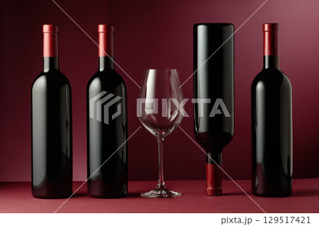 Red wine on a dark red background. 129517421