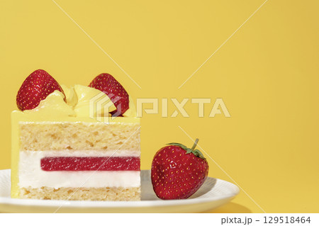 Strawberry lemon sponge cake displayed on a white plate, garnished with fresh strawberries, showcasing vibrant colors and textures, ideal for dessert and pastry menu concepts with copy space Strawberry lemon sponge cake displayed on a white plate, garnished with fresh strawberries, showcasing vibrant colors and textures, ideal for dessert and pastry menu concepts with copy space 129518464