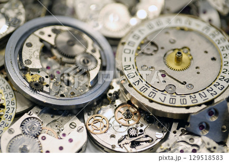 Old mechanical watches with gears and cogs. Watch or clock mechanisms 129518583