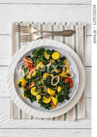 zucchini kale tomato saute sprinkled with sesame 129519038