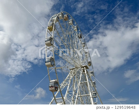 Ferris wheel on the background of blue sky in summer. High quality photo Ferris wheel on the background of blue sky in summer. High quality photo 129519648