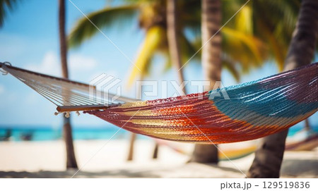 Tropical Relaxation: Hammock with Blurred Caribbean Beach Background. Generative ai 129519836
