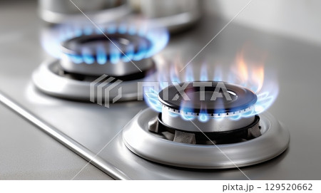 Flames rising from a gas stove during dinner preparation at home Flames rising from a gas stove during dinner preparation at home 129520662