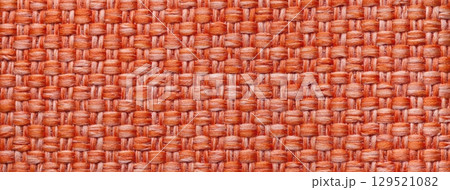 Dark orange woven textile macro texture background. Knitted fabric pattern for material design and backdrop 129521082