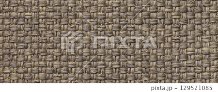 Dark brown woven textile macro texture background. Knitted beige fabric pattern for material design and backdrop 129521085