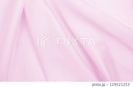 Smooth elegant pink silk or satin texture as wedding background. Luxurious background design 129521253