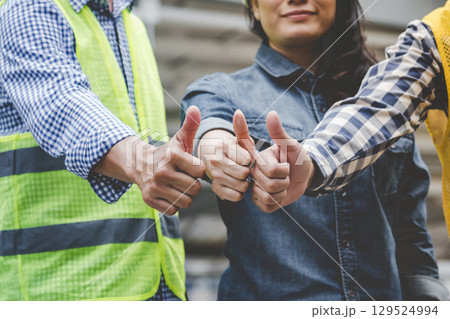 Group of multiracial people Teamwork meeting join hands Engineer Manager Foreman fist bump together. Close up diversity engineer people hands partner teams. Business connection team join partnership Group of multiracial people Teamwork meeting join hands Engineer Manager Foreman fist bump together. Close up diversity engineer people hands partner teams. Business connection team join partnership 129524994