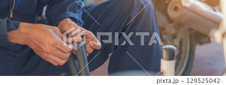 Banner Man hands fixing Car machinery vehicle mechanical service. Mechanic man hands repairing car shop. panoramaopen vehicle hood checking up auto mobile. Car maintenance engineer with copy sapce. Banner Man hands fixing Car machinery vehicle mechanical service. Mechanic man hands repairing car shop. panoramaopen vehicle hood checking up auto mobile. Car maintenance engineer with copy sapce. 129525042